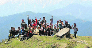Trekkers on a hilltop on the Dalhousie-Khajjiar trek.