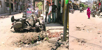 A road in a pitiable condition. Despite several pleas, the road has not been repaired; (right) A road that has not been recarpeted for years.