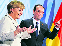 German Chancellor Angela Merkel and new French President Francois Hollande in Berlin