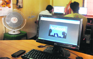 A Facebook graphic is displayed on a computer screen in Siliguri. Facebook boosted the number of shares for sale at its stock market debut by 25%, amid signs of strong investor demand for its IPO. Facebook counts India, along with the United States and Brazil, as its main growth drivers, the firm has said in a regulatory filing