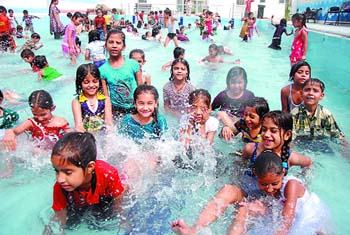 With the mercury climbing, beating the heat seems to be uppermost on the minds of all. The picture above shows students of Lord Rama Public School enjoying a splash in the pool on Thursday while young boys (below) dive into the Sirhind canal with a panache that would put to shame even the seasoned swimmers.