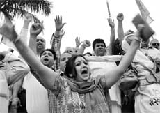 BJP workers protest at the roundabout separating Sectors 17 and 18 in Panchkula on Thursday.