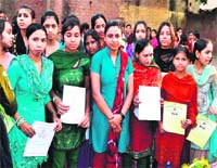 Circle Officer Shah Jahan Javed Khan with Muslim girls who have excelled in various self-employment trades in Haridwar on Thursday.