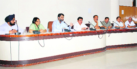 Dignitaries at a press conference in Kurukshetra.