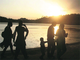 Tourists enjoy a majestic view of the sunset on the banks of the Surinsar Lake in Jammu.
