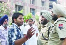 Police officials investigate the firing incident at the Civil Hospital in Amritsar on Friday.