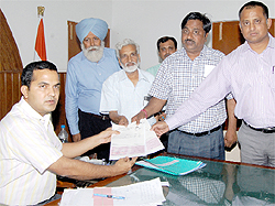 Bathinda refinery officials handing over to the Deputy Commissioner KK Yadav a financial aid for the Red Cross De-addiction Centre situated on the Civil Hospital premises in Bathinda