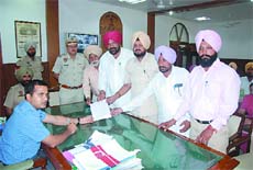 Members of the Atyachar Virodhi Committee submit a memorandum to the Deputy Commissioner, Kamal Kishore Yadav, in Bathinda on Friday.