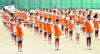 Students of Unison World School participate in the "Big Dance" in an attempt to enter the Guinness Book of World Records for the largest simultaneous dance routine at multi-venues in Dehradun on Friday.