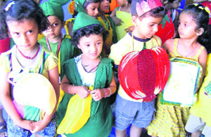 Children of Bachpan Play School dressed as fruits during an event in Haridwar on Friday.