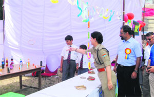Dehradun SSP Neeru Garg enjoys a fun game at the Summer Carnival at St Josephs Academy in Dehradun. 
