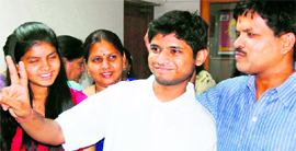 IIT-JEE topper Arpit Aggarwal in a jubilant mood with his father, mother and sister in Faridabad on Friday.