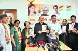 Congress leaders release the party manifesto in Shimla on Friday. Photo: Amit Kanwar