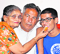 Ishaan Batta of Khanna, who scored the 186th rank in the IIT exam, poses with his grandparents