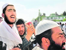 Afghan demonstrators shout slogans during a protest against the US and the government of Afghanistan in Kabul on Friday. 
