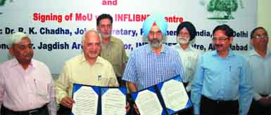 Vice-Chancellor of the Central University of Punjab Prof Jai Rup Singh (centre) with the director of INFLIBNET Centre, Jagdish Arora, to his right, after signing a memorandum of understanding, on the universitys city campus in Bathinda on Saturday. Also seen in the picture are Joint Secretary, Parliament of India, Dr RK Chadha, RG Saini, Prof PS Ramana, Jagdev Kartar Singh, and Prof P Ramarao. Tribune Photo: Pawan Sharma