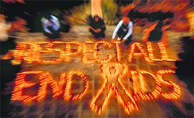 Volunteers prepare the slogan Respect All End AIDS at the Commonwealth Asian Centre, Sector 12, Chandigarh, on Saturday