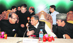 Jammu and Kashmir Pradesh Congress Committee chief Saifuddin Soz makes a point as AICC general secretary Janardhan Dwivedi and Union Health Minister Ghulam Nabi Azad look on during a state-level delegate session of the party in Srinagar on Saturday.
