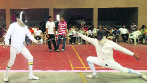 Fencers in action during the Jammu District Fencing Championship at MA Stadium in Jammu.