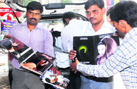 The raiding team shows publicity material seized from beauty salons in Jalandhar on Saturday. 