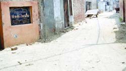 A road remains unpaved even after its foundation stone was laid a year ago