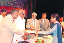 Chief Minister Bhupinder Singh Hooda lights the inaugural lamp of the Students Legal Literacy Mission in Rohtak on Sunday. 
