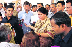 Haryana Education Minister Geeta Bhukkal listens to public grievances in Jhajjar on Sunday. 