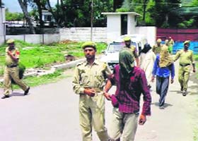 An LeT operative being led away by the police in Poonch