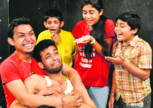Artistes enact a scene of the play Nanha Nakalchi in Jammu