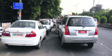 Wrongly parked vehicles of senior BJP leaders outside KL Saigal Memorial Hall on Bhagwan Mahavir Marg in Jalandhar on Sunday.