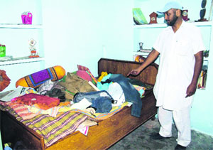 The owner shows the ransacked house in Jalandhar.