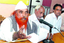 Followers of Peer Hazi Shah Qutab address mediapersons in Jalandhar.