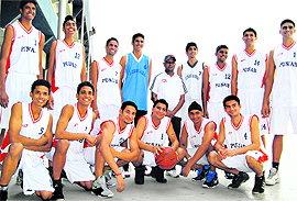 The junior boys team with the coach at Guru Nanak Stadium, in Ludhiana, on Sunday