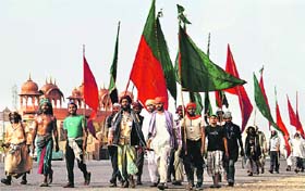 Kalandars (wandering ascetics) arrive in Ajmer on foot from Delhi to attend the 800th Urs of Khwaja Moinuddin Chishti in Ajmer on Sunday