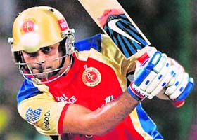 Royal Challenger Bangalores skipper Virat Kohli plays a shot during their match against Deccan on Sunday