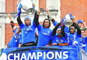 CELEBRATING MAIDEN TITLE: (From left) Chelseas Ashley Cole, Didier Drogba, Jose Bosingwa, Salomon Kalou and John Obi Mikel celebrate during an open top bus victory parade in London on Sunday