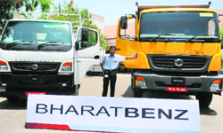 V. Sreeram, Daimler India's assistant vice-president for marketing and sales, poses with Bharat Benz vehicles in Ahmedabad on Monday. The vehicles were on display for the 'Bharat Benz Power Yatra', which will cover some 22 cities in over 70 days to showcase the performance and efficiency of Bharat Benz on Indian roads.  AF