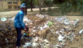 The three pits dug by the students of the government secondary school, Maiserkhana, are being used to dump degradable, non-degradable waste and for the generation of compost.