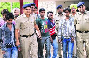 The six accused being taken to a court in Chandigarh on Monday.