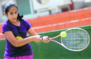 A player in action during a tennis match at the CLTA, Sector 10, in Chandigarh on Monday.