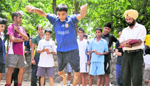 SAI officials conduct trials for the Sports Wing at Panjab University, Chandigarh, on Monday. 