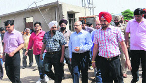 Officials of the Nayagaon NAC return after carrying out a "half-hearted" demolition drive in the catchment area that falls in Kansal village.