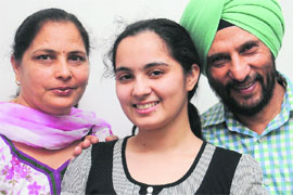 Sukrit Kaur with her parents in Chandigarh on Monday.