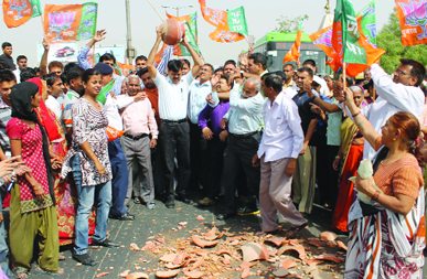 BJP MLA from Bijwasan Sat Prakash Rana and his party activists block the Dawarka flyover during a protest against water crisis in their area, in New Delhi on Monday. 