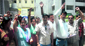 Members of the Dev Bhoomi Mahasabha hold a protest in Dehradun on Monday.
