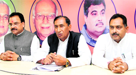 Uttarakhand BJP chief Bishan Singh Chufal (centre) addresses a press conference in Dehradun on Monday.