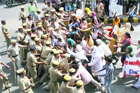 Police constables stall the advance of the All-India Democratic Womens Association activists who held a protest march on the NH-10 against child abuse cases in Haryana