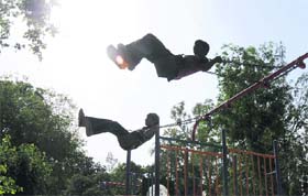 UP IN THE SKY: Children enjoy swings at Karan Park in Karnal