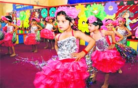 Kids of Euro International School give a performance during a function to mark Mothers Day on the school campus in Gurgaon