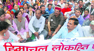 HLP activists hold a protest at the Raj Bhawan in Shimla on Monday. 